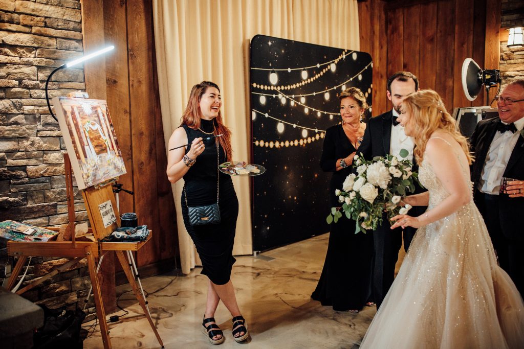 Surprise reveal of live wedding painting. live wedding painter, Pittsburgh, Seven Springs. Painted by OlgaNova Studio, Olga Mendenhall